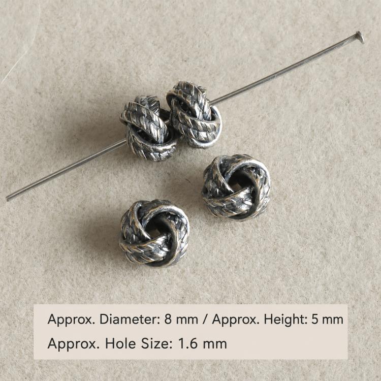 Textured twisted dark silver bead spacers on a pin, with small hole size