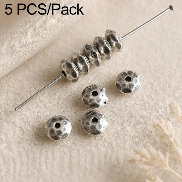 Textured round coin spacer beads with central holes, dark silver tone set