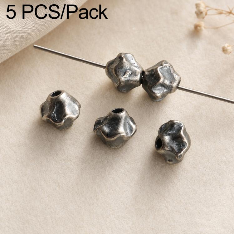Four small dark silver cube-like bead spacers with holes on a pin, textured finish