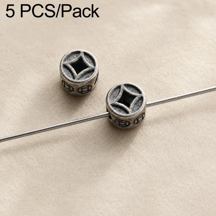 Two round dark silver beads with star-like carved patterns and central holes