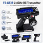 Black RC transmitter with blue LCD display, steering wheel, and ergonomic grip
