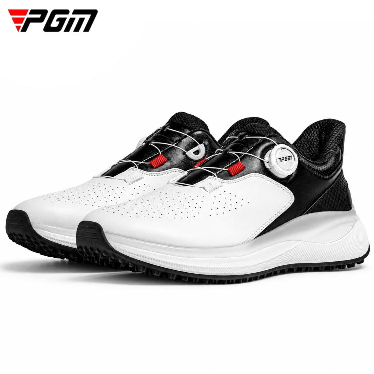 Men’s white-and-black golf shoe with red highlights, padded tongue, and spiked tread sole.