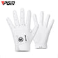 Pair of white kids golf gloves with perforated fingers and padded palm
