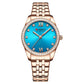 Women’s rose gold quartz watch with blue dial, rhinestone bezel, and metal bracelet