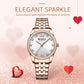 Women’s rose gold quartz watch with white dial, rhinestone bezel, and metal bracelet