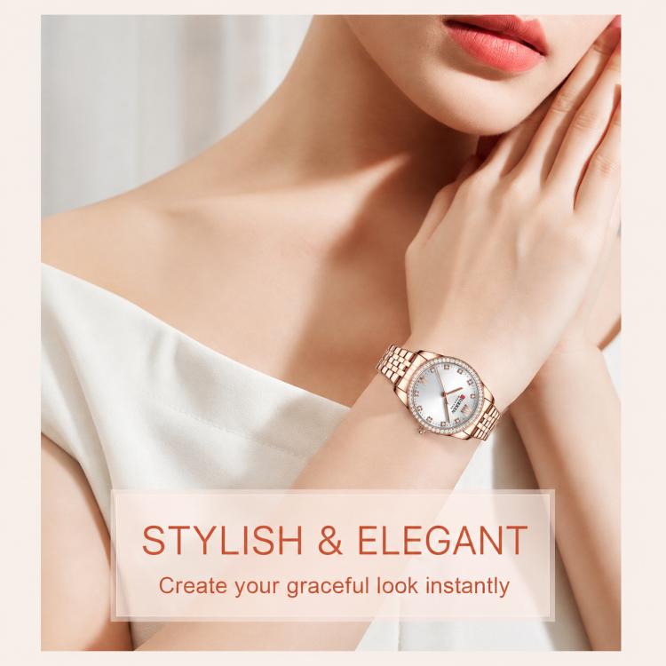 Women’s rose gold quartz wristwatch with white dial and rhinestone bezel on wrist