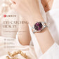Two-tone women’s quartz watch on wrist, purple dial with roman numerals and date.