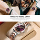 Two-tone women’s quartz watch on wrist, purple dial with roman numerals and date.