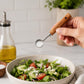 Stainless steel measuring cup spoon with wooden handle scooping sugar for cooking measure