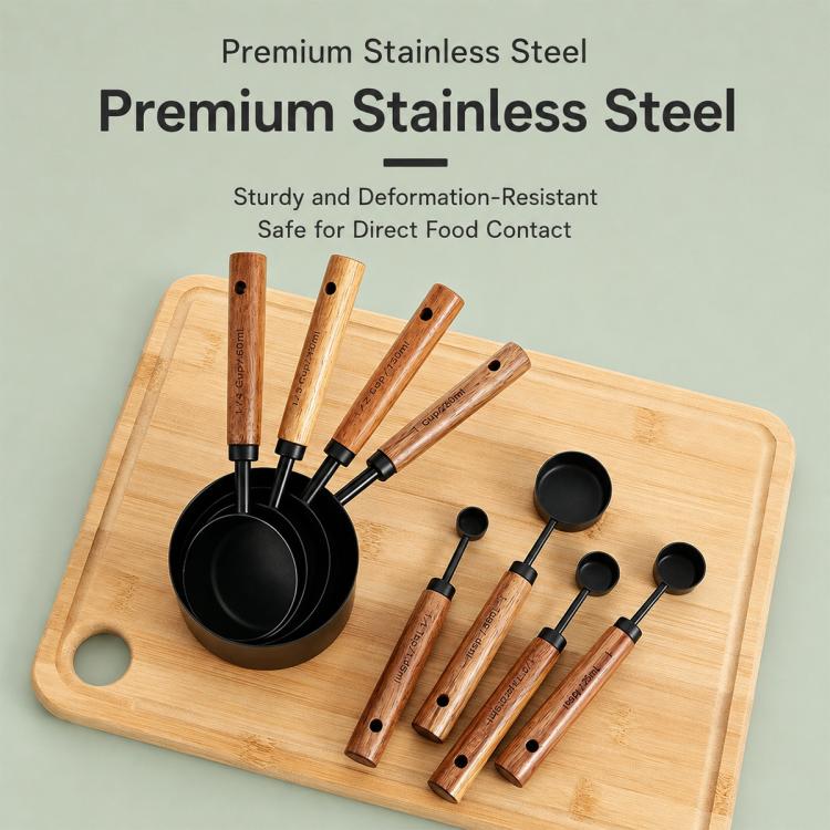 Stainless steel measuring cups and spoons set with black handles and gold bowls