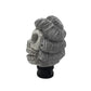 Gray skull-style manual gear shift knob with spiral hair detail