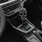 Gray skull-style manual gear shift knob shown on car interior shift lever