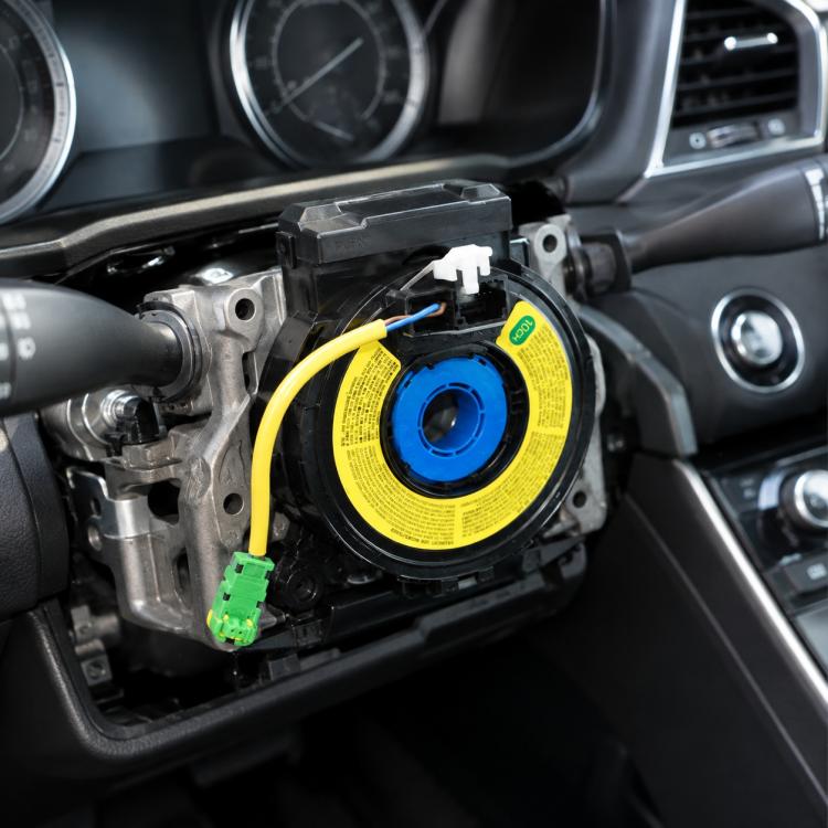 Steering wheel airbag clock spring spiral cable with yellow label, blue center, green connector