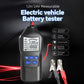 Electric vehicle battery tester with LCD screen and clamp leads, handheld car tool.