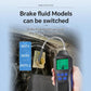 Digital brake fluid tester held near engine bay with selectable DOT model panel