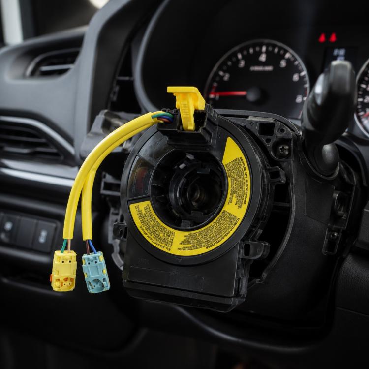 Steering wheel clock spring spiral cable with black housing and yellow wire connectors