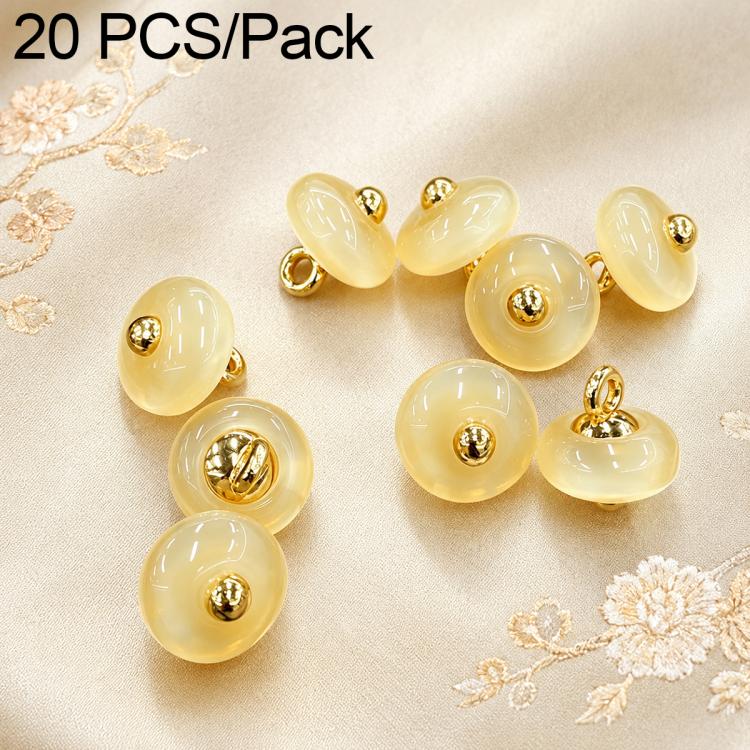 Pale yellow resin disc buttons with gold loops, glossy finish, small round design