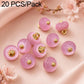 Pink resin disc buttons with gold loops, glossy finish, small round design