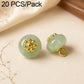 Mint green resin flat flower-shank buttons with gold decorative flower tops, 2 shown