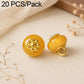 Yellow resin flat flower-shank buttons with gold decorative flower tops, 2 shown