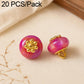 Pink resin flat flower-shank buttons with gold decorative flower tops, 2 shown
