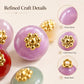 Purple glossy resin floral shank button with gold flower top and round gold center
