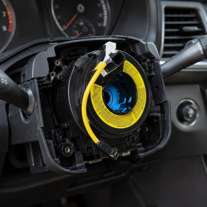 Car steering wheel airbag clock spring, black housing with yellow spiral cable and connector