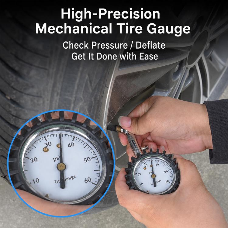 Car tire pressure gauge with brass-style dial, attached to a tire valve