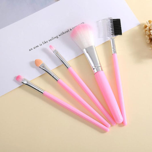 Pink makeup brush set with five soft bristles and silver ferrules