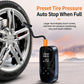 Black portable digital tire inflator with hose and digital pressure display near wheel