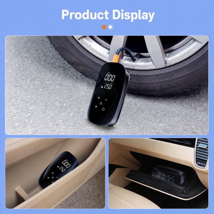 Black portable tire inflator with digital display and attached hose near car wheel