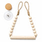 Wooden beaded towel rack with circular mounting plate and hanging bead garland