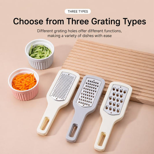 Three interchangeable grating heads on a stainless steel vegetable grater handle