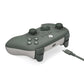 Green wired gaming controller side view with textured grips and connected cable