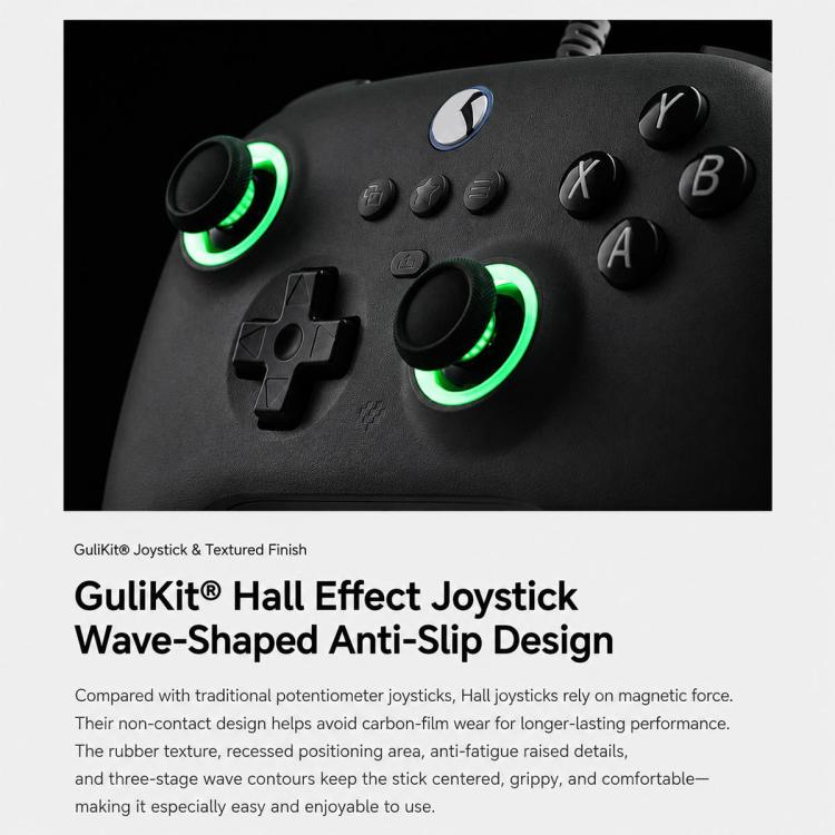 Close-up of black gaming controller with green glowing ring accents on buttons