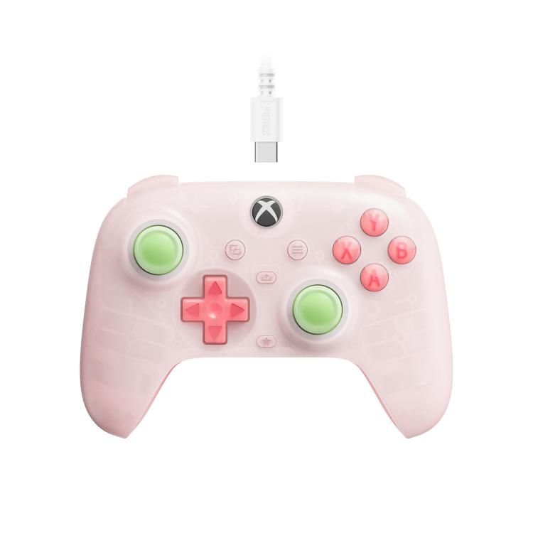 Translucent pink wired gaming controller with glowing green and red button accents