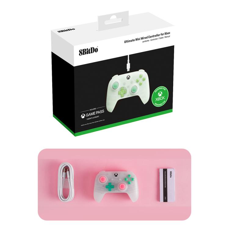 Gaming controller retail box with translucent pink controller and accessories