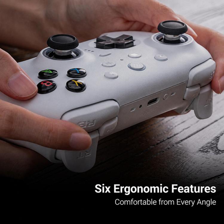 White 2.4G Bluetooth game controller with dual analog sticks, close-up