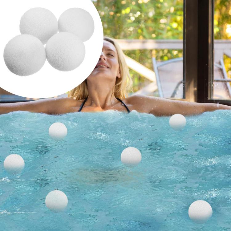 Reusable oil-absorbent sponge balls (3-inch) floating in pool water