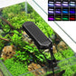 Clip-on aquarium LED light attached to a glass tank over plants and rocks