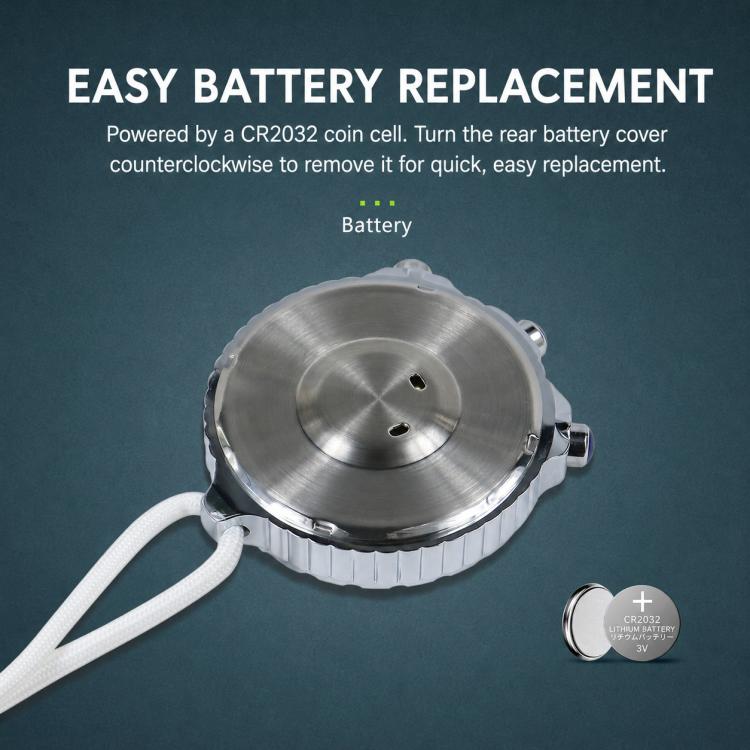Silver stopwatch with rear battery cover and white cord, underside facing camera