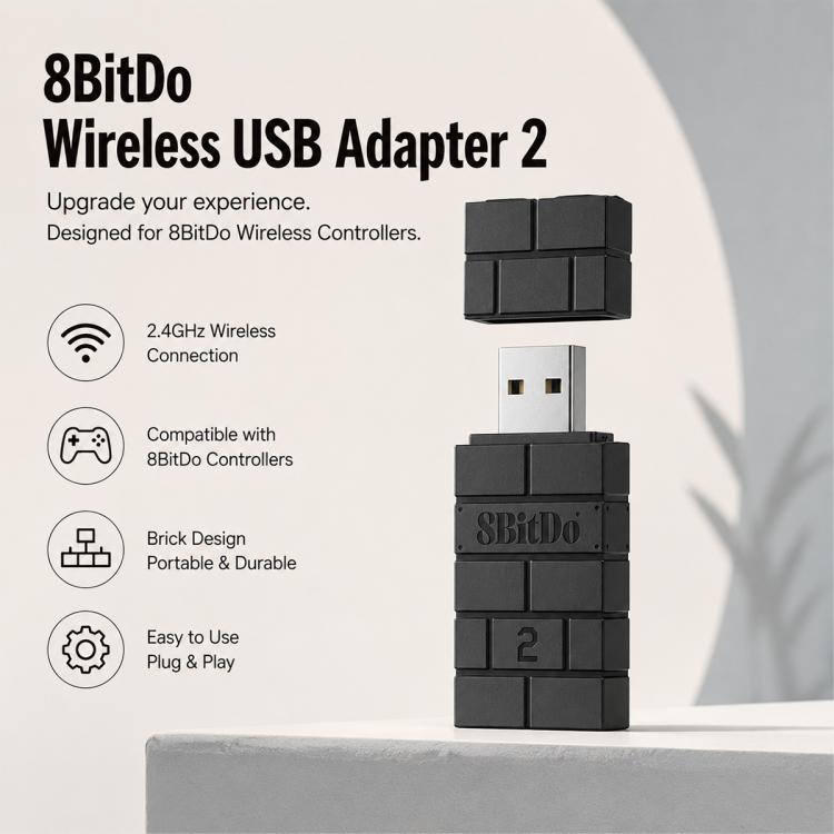 8BitDo wireless USB adapter with dark stacked housing and USB plug, front view.