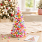 Beaded rainbow holiday tree decoration with multi-color pearl beads and star topper