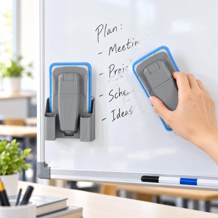 Grey magnetic spray board eraser with detachable washable pad, pressed to whiteboard