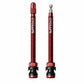 Pair of red Presta tubeless valve extenders with extended aluminum stems and rubber bases