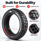 Solid rubber scooter tire with black tread and red side stripe, honeycomb interior detail