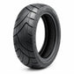 Black scooter tire with deep tread and visible inner rim surface