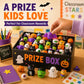 Prize box filled with Halloween mochi squishy figures, including pumpkin and cat shapes