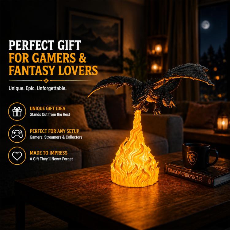 Black dragon night light with yellow flames on table with stack of books and mug.