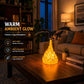 Black dragon night light with yellow flames, dragon perched on base in living room.